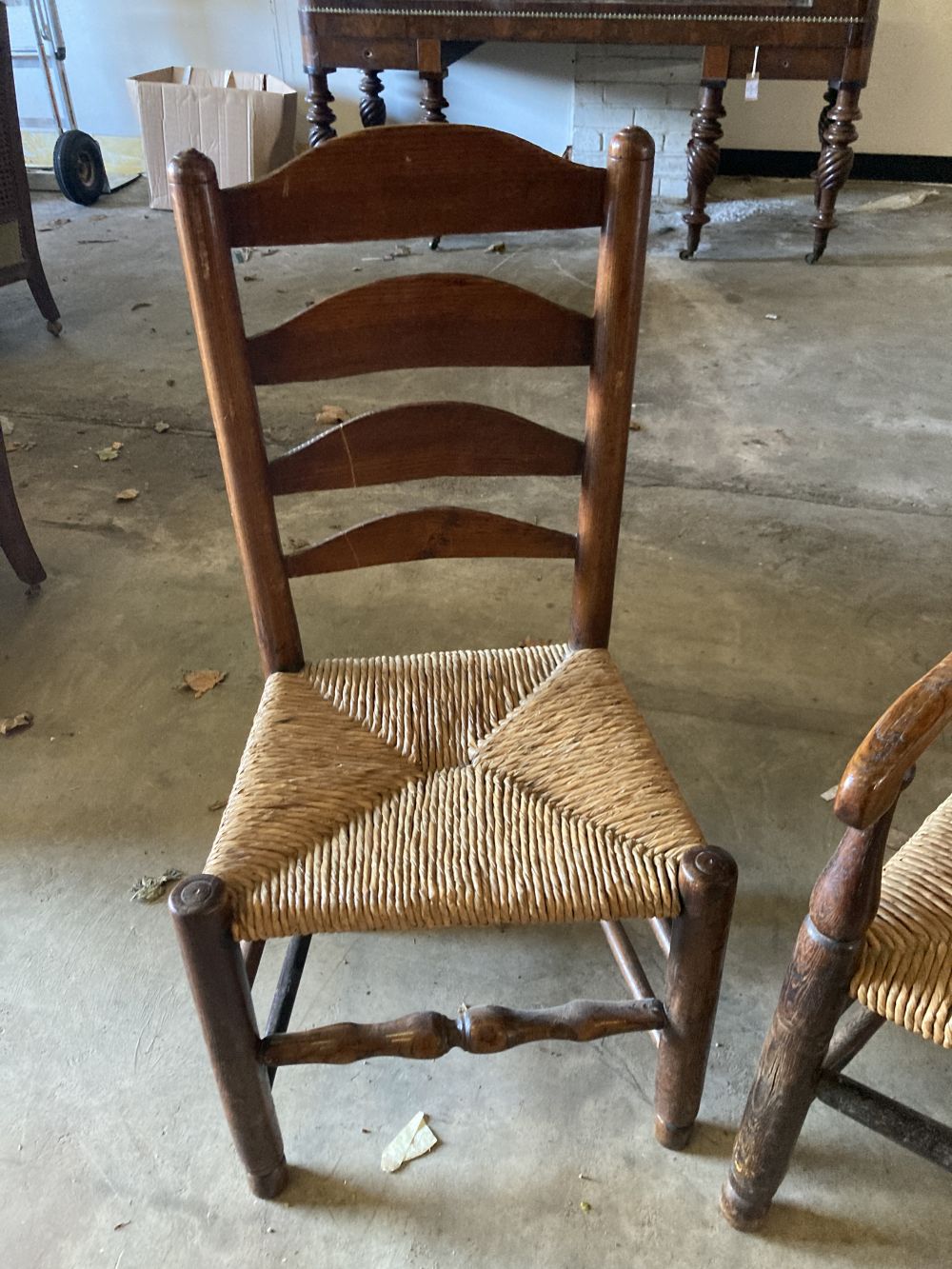 A set of eight rush seat ladderback dining chairs (two with arms)